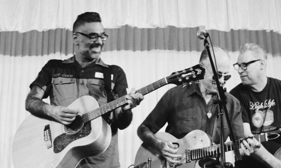 The Dodge Brothers perform live on stage in monochrome.